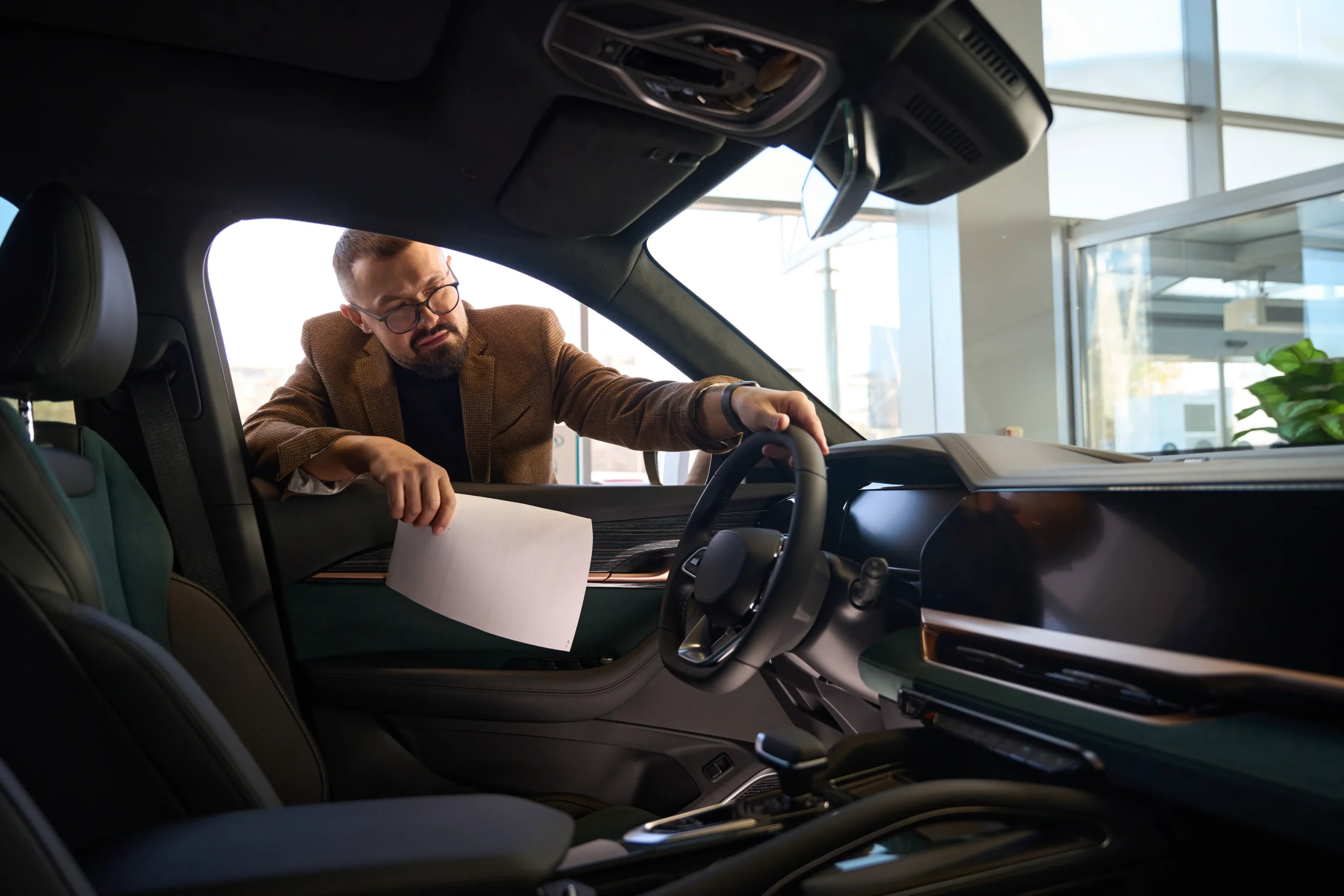 man-in-a-car-dealership-chooses-a-car-2024-03-25-23-37-31-utc man-in-a-car-dealership-chooses-a-car-2024-03-25-23-37-31-utc